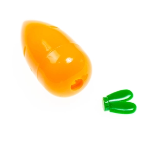 Detail view of disassembled carrot pencil sharpener parts in orange and green plastic
