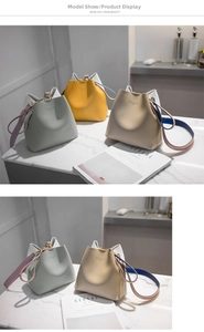 Detailed macro view of high-quality lychee texture leather bucket bags in multiple colors