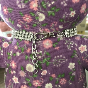 Detail of three-row rhinestone pet collar with silver finish and adjustable lobster clasp