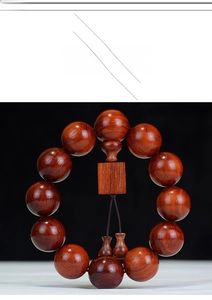 Macro shot of polished Brazilian Rosewood beads with natural wood grain texture