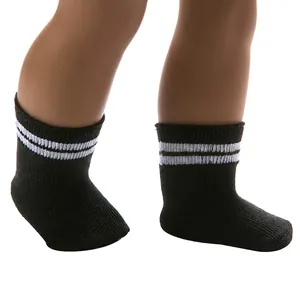 Detail of 18 inch doll black knit socks with white stripes shown on doll legs