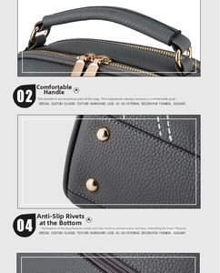 Detail of grey lychee leather handbag featuring metal zipper and bottom protective studs
