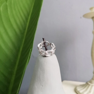 925 Sterling silver chain ring with pavé cubic zirconia on a gray display stand