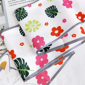 Close-up of floral animal print silk scarf with green palm leaves and pink flowers