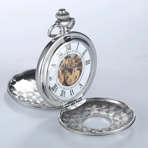 Detail of silver mechanical pocket watch showing fish scale pattern and inner gold gears