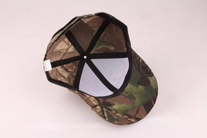 Detailed interior of camouflage baseball cap showing stitching and care label