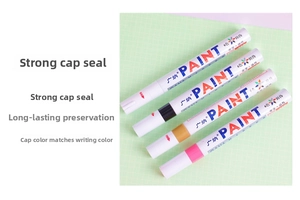 Detail of oil-based paint markers in multiple colors with medium tip and secure caps