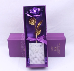 Detail of 24K gold foil purple rose in luxury gift box with golden Love lettering