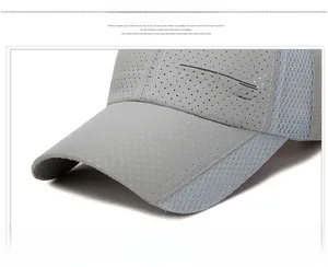 Detail of grey baseball cap showing breathable perforated fabric and Sports logo