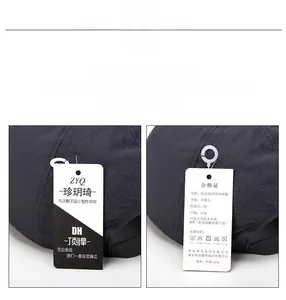 Detail of dark grey breathable mesh cap with official brand hangtags and product labels
