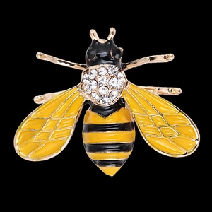 Golden bee brooch with yellow black enamel and sparkling rhinestones on black background