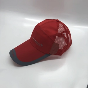 Detail of red mesh baseball cap featuring breathable fabric and Modern British side logo