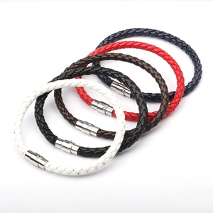 Detail of multi-color woven leather bracelets with polished magnetic metal clasps