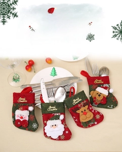 Detail view of festive Christmas stocking cutlery holders with cartoon character embroidery