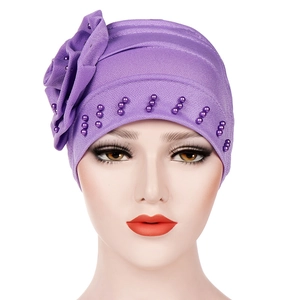 Elegant purple turban hat with large side flower and matching bead decorations for women