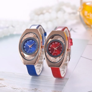 Elegant rose gold quartz watches with leather straps next to luxury accessories