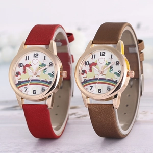 Close-up of rose gold quartz watches featuring rainbow unicorn motifs and leather straps