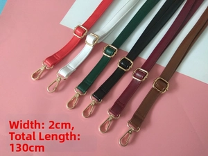 Detail view of 2cm wide and 130cm long adjustable PU leather strap with gold buckle