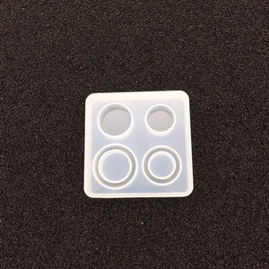 Macro view of a 4-hole square silicone mold for DIY resin jewelry and ashtray making