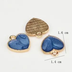 Pearlescent blue heart charms for jewelry making with star dust glitter and gold edges