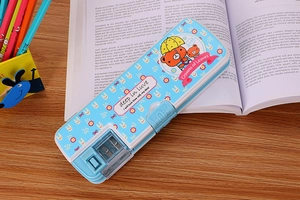 Close-up of kids cartoon pencil case with built-in sharpener and blue pattern