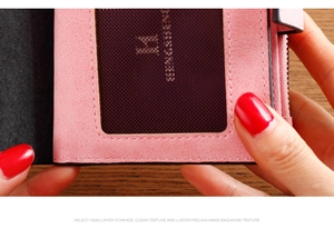 Detail view of pink leather wallet showing card slots and premium stitching quality