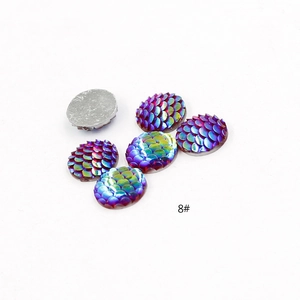 Macro detail of iridescent fish scale resin cabochons for DIY jewelry making