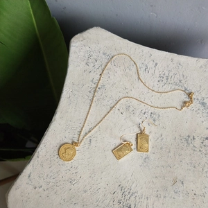 Detail of 925 silver gold coin necklace and earrings set with Elizabeth II relief