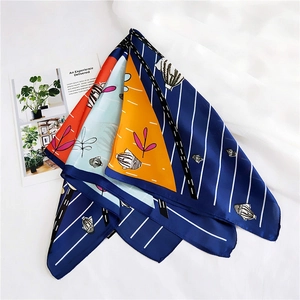 Detail of Korean style silk scarf featuring tropical fish patterns and palm leaf prints