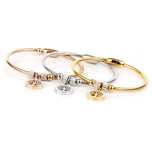 Three-piece Tree of Life bangles in gold, silver and rose gold with magnetic clasps