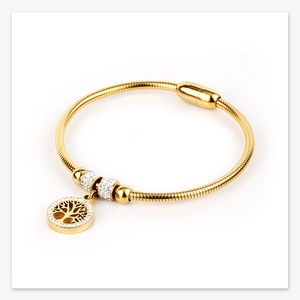Close-up of golden Life Tree bracelet with crystal beads and magnetic clasp detail