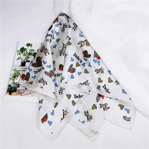 Detail of white square silk scarf with zebra and colorful heart prints for women