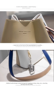Detail of lychee pattern leather bucket bag with contrast shoulder strap and gold hardware