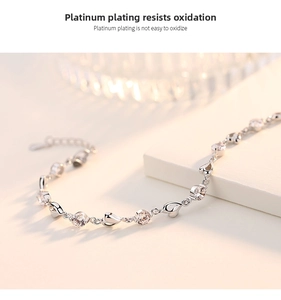 Detail of 925 silver heart bracelet with sparkling zircons and platinum plating finish