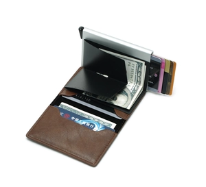 Detail of brown leather RFID wallet showing card pop-up mechanism and silver metal box