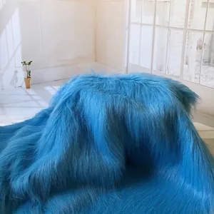 Luxurious bright blue long faux fur fabric with silky texture for home decor and apparel