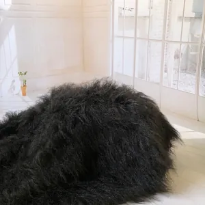 Luxurious black long-pile faux fur rug with soft fluffy texture for home decor