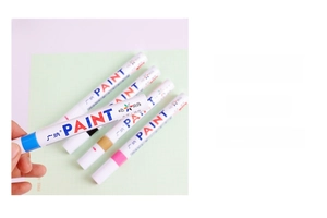 Macro detail of the medium-point paint marker tip and waterproof oil-based ink coverage