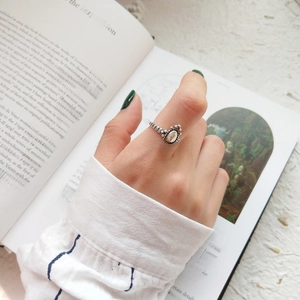 Retro style sterling silver ring with oval clear gemstone and textured band