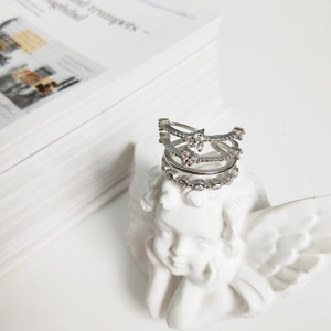 Elegant 925 sterling silver four-layer ring set with zircon accents on white background