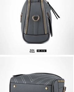 Detailed side and bottom view of grey pebble leather handbag with gold-tone hardware