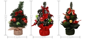 Detailed size view of three 22cm mini table Christmas trees with various ornaments