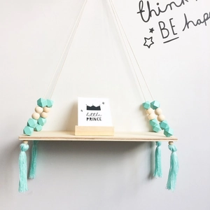 Detail of Nordic wall shelf with macaron octagon beads, tassels and little prince card