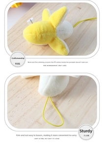 Close-up of a plush banana keychain showing stitching details and soft PP cotton filling