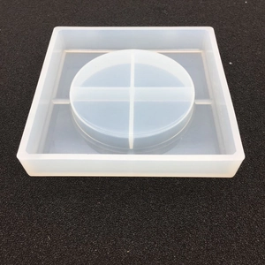 Macro view of square silicone mold with cross-divided circular slot for DIY resin tray