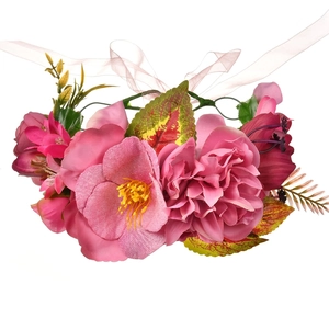 Detail of pink and magenta silk fabric rose hair clip with realistic leaves and ribbon