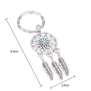 Dreamcatcher keychain dimensions 9.4cm by 2.6cm with blue bead and silver feathers