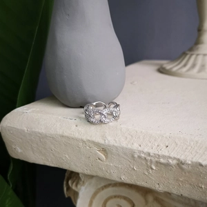 Macro view of silver S925 chain ring featuring micro-paved cubic zirconia stones