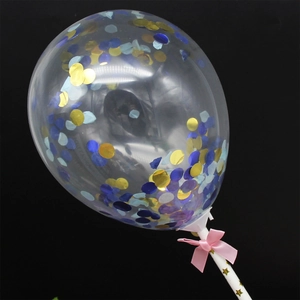 Detailed view of 5-inch clear cake topper balloon with blue and gold confetti and pink bow