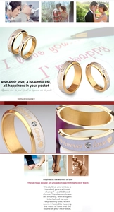 Detail of couple rings with Forever Love engraving, brushed finish, and tension-set stone